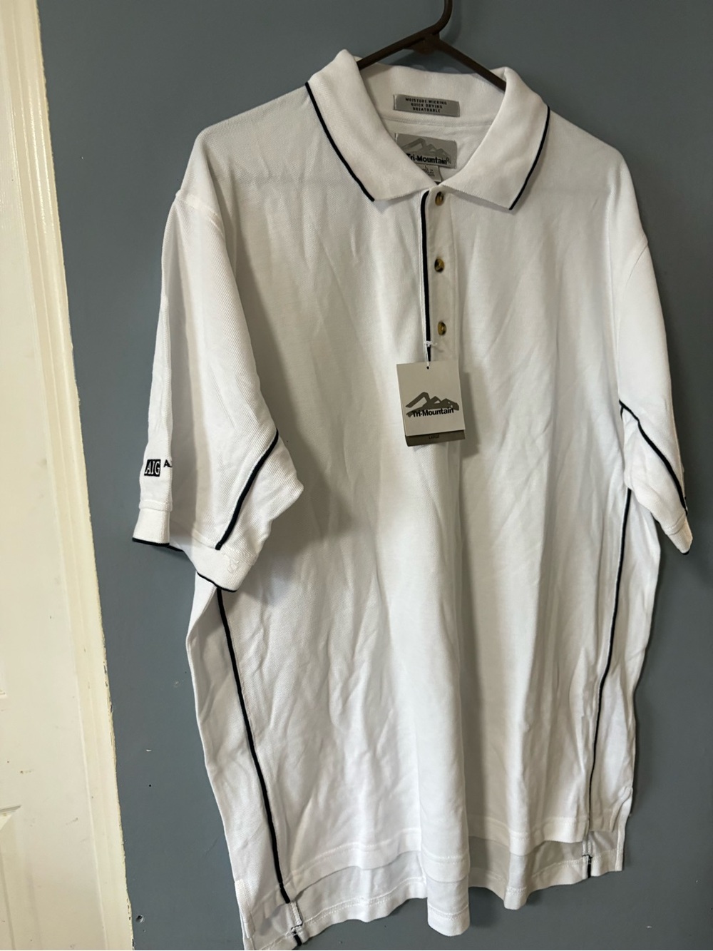 White Polo with Black Piping - The Mountain
